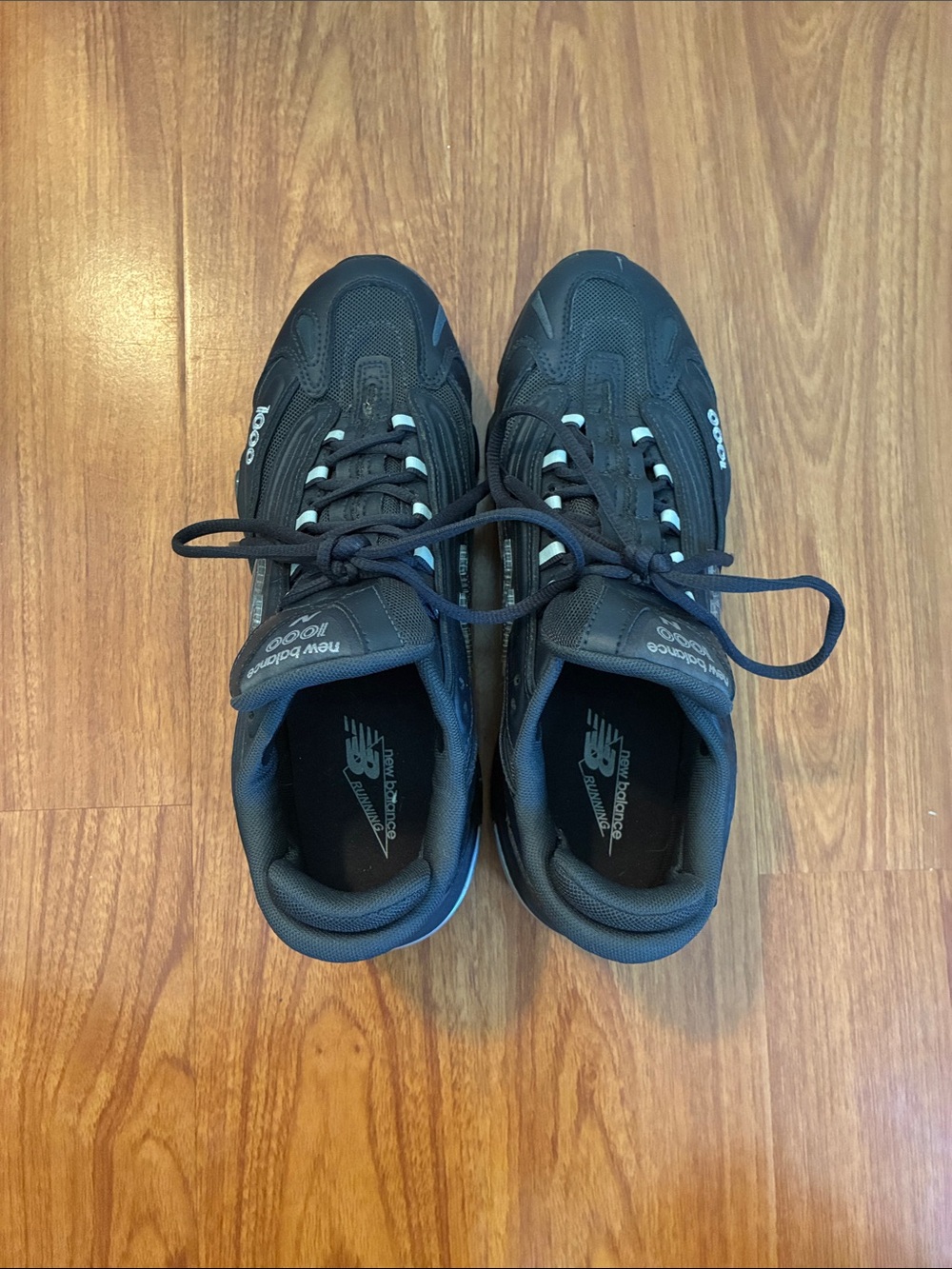 New Balance Men's Black with Blue Accent Athletic Sneakers